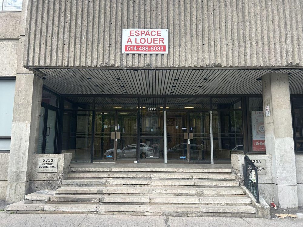 Main entrance — steps with no ramp, two sets of non-automated doors