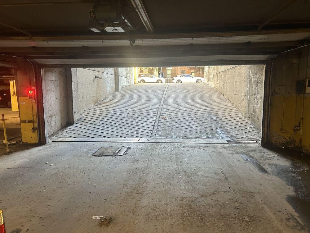 Slanted driveway ramp inside the garage